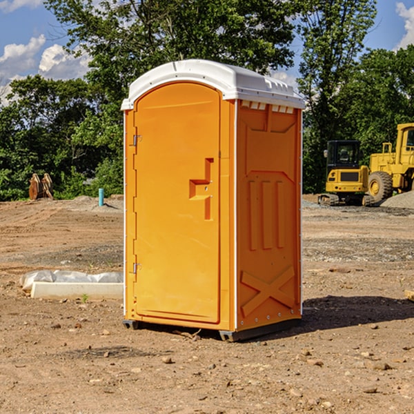 what is the cost difference between standard and deluxe portable restroom rentals in Anoka County